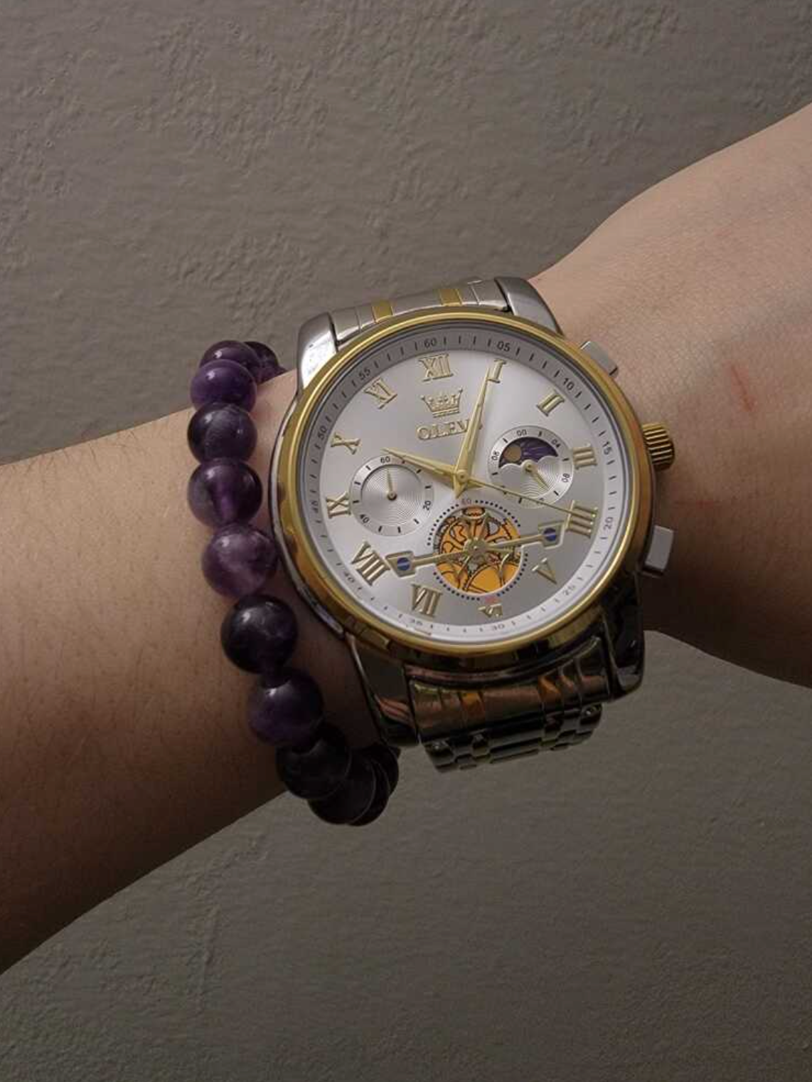  OLEVS watch on black background